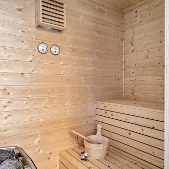 wooden sauna with bucket and ladle for detox